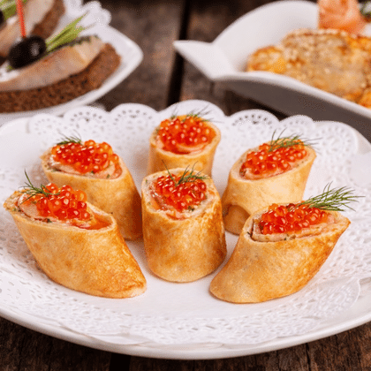 Рулетики из блинчиков с семгой и икрой