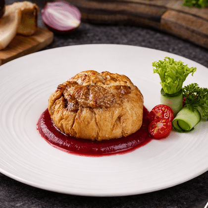 Свинина "Уральская" с белыми грибами под брусничным соусом