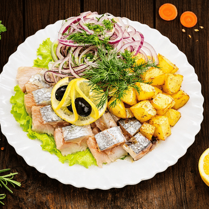 Сельдь по- русски с  картофелем и луком